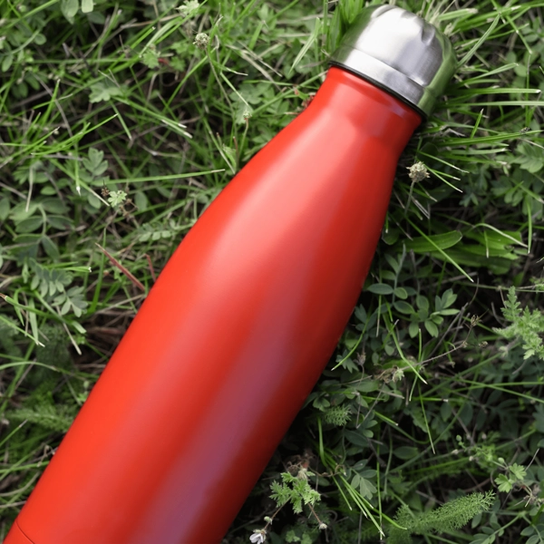 water bottle on a green grass field